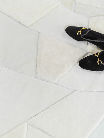 Arctic cowhide rug in soft neutral tones