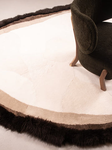 Custom shaped shearling rug with ROCK PAPER EDGE effect