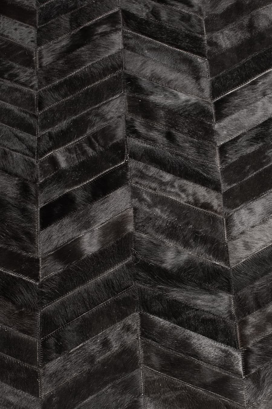 ROUND HERRINGBONE – Large Designer Cowhide Rug