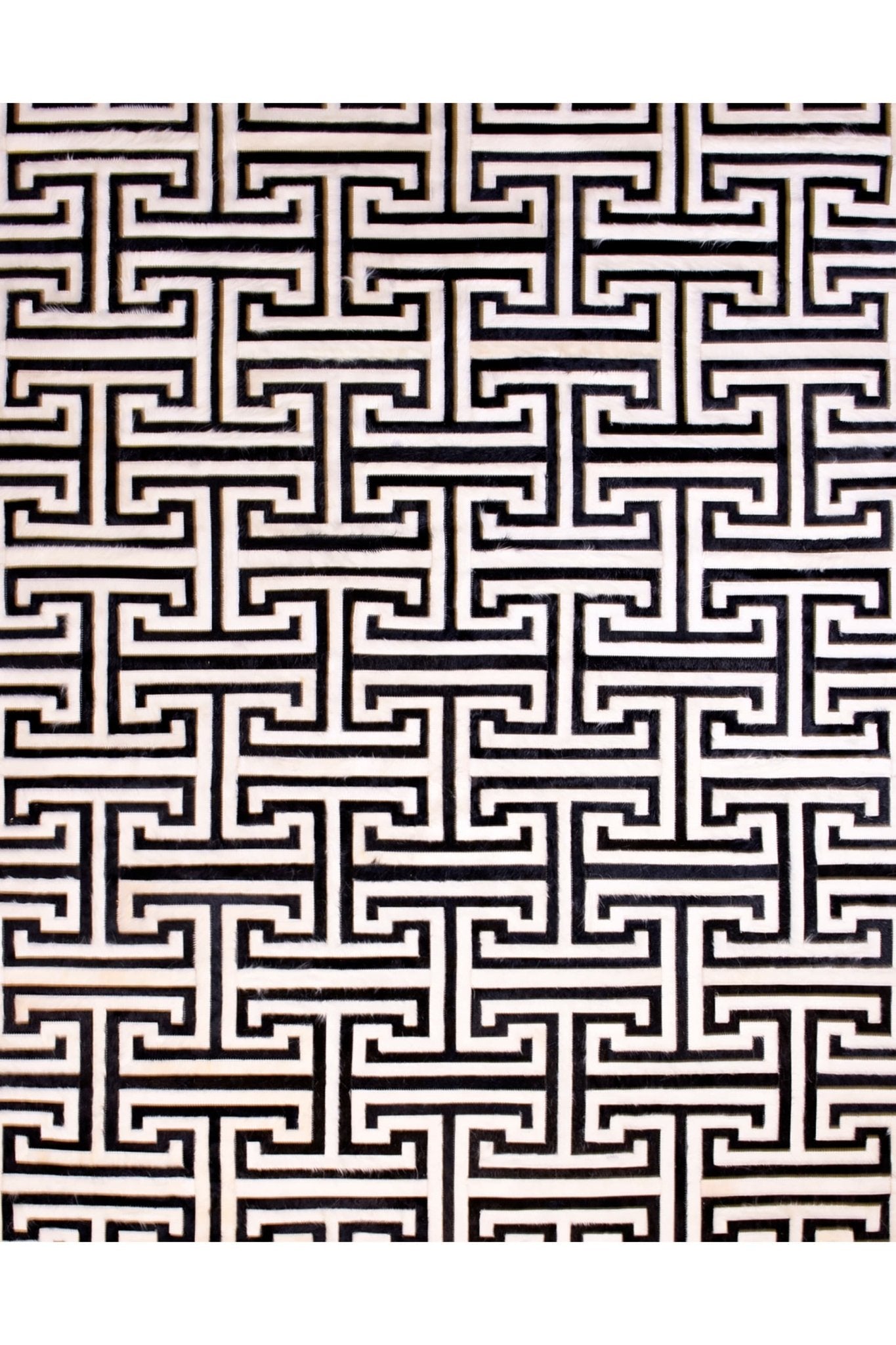 T MODEL – Maze-Inspired Cowhide Patch Rug