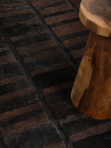 Walkway designer rug by Homelosophy in brown and deep black tones