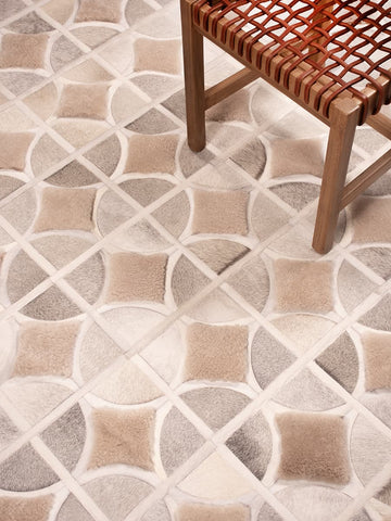 ALPHA rug styled with wooden chair woven with thick leather straps by Homelosophy