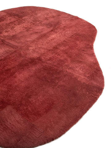 Custom shaped wool rug in organic amoeba form