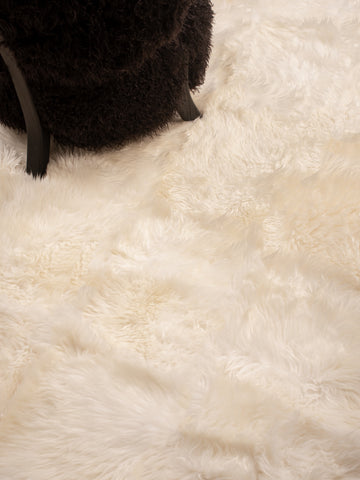 White sheepskin rug styled in Scandinavian living room