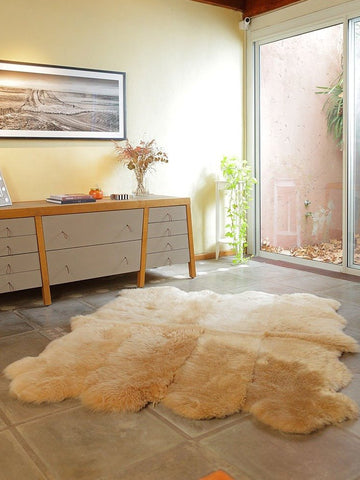 8-Pelt Sheepskin Area Rug in beige camel, handcrafted from eight Patagonian hides with soft texture and organic shape.