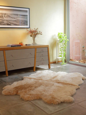 Six Pelt Sheepskin Area Rug in beige camel, handcrafted from six Patagonian hides with organic shape and soft wool texture.